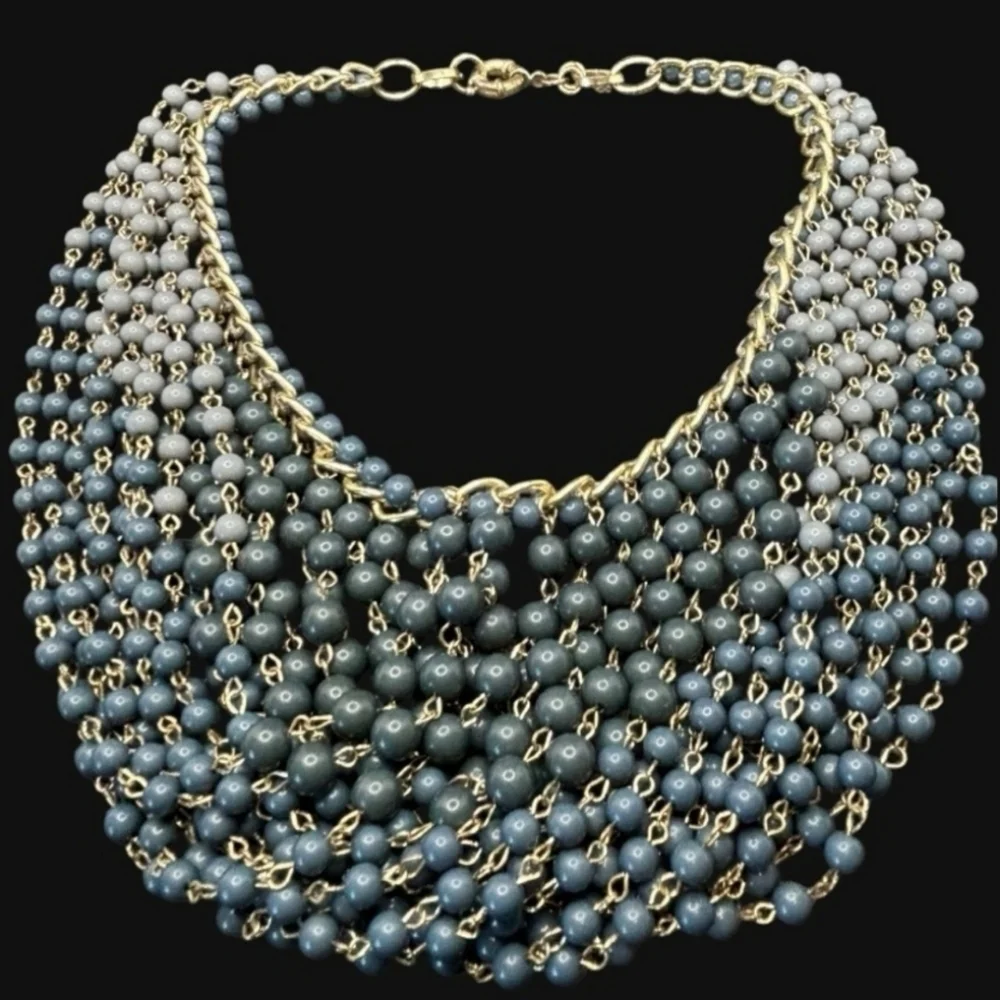 Gold plated cuban link chain with dangling graduated color jasper roundbeads